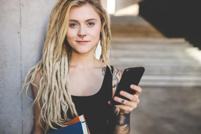 Young-College-Student-Holding-Phone Young College Student Holding Phone